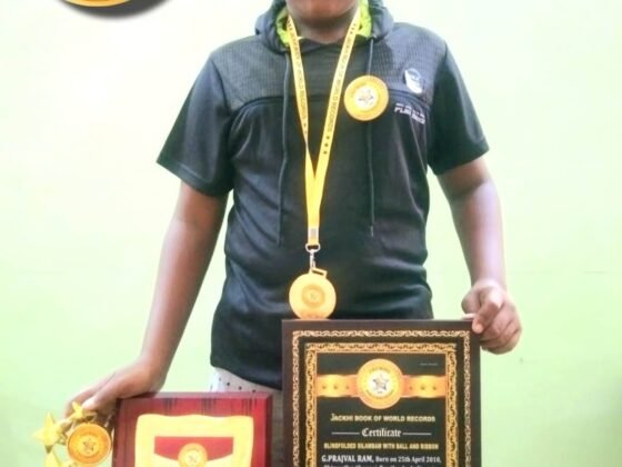 BLINDFOLDED SILAMBAM WITH BALL AND RIBBON