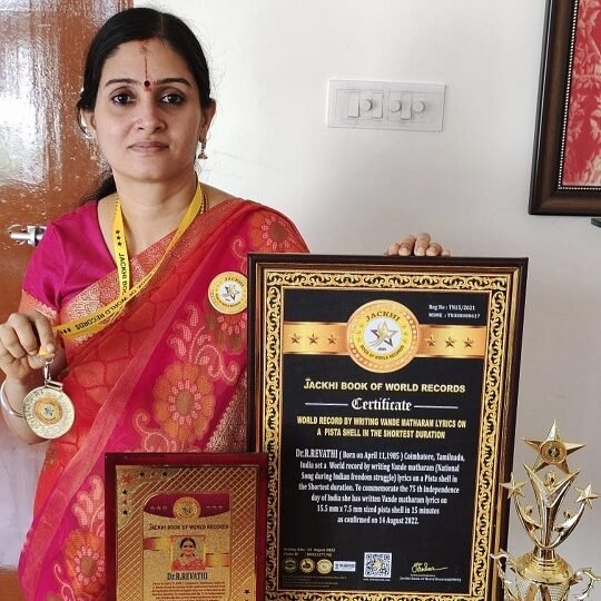 WORLD RECORD BY WRITING VANDE MATHARAM LYRICS ON A PISTA SEED IN THE SHORTEST DURATION