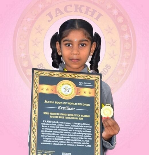 WORLD RECORD ON LONGEST  DOUBLE-HANDED  SILAMBAM ROTATION WHILE TRAVELING ON A BOAT