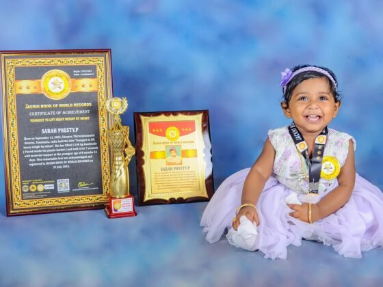 YOUNGEST TO LIFT HEAVY WEIGHT BY INFANT